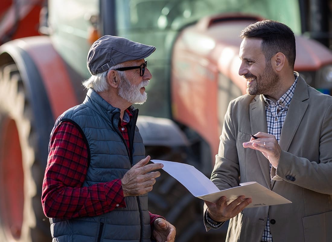 Contact - Farmer and Agent Talking Together Outside